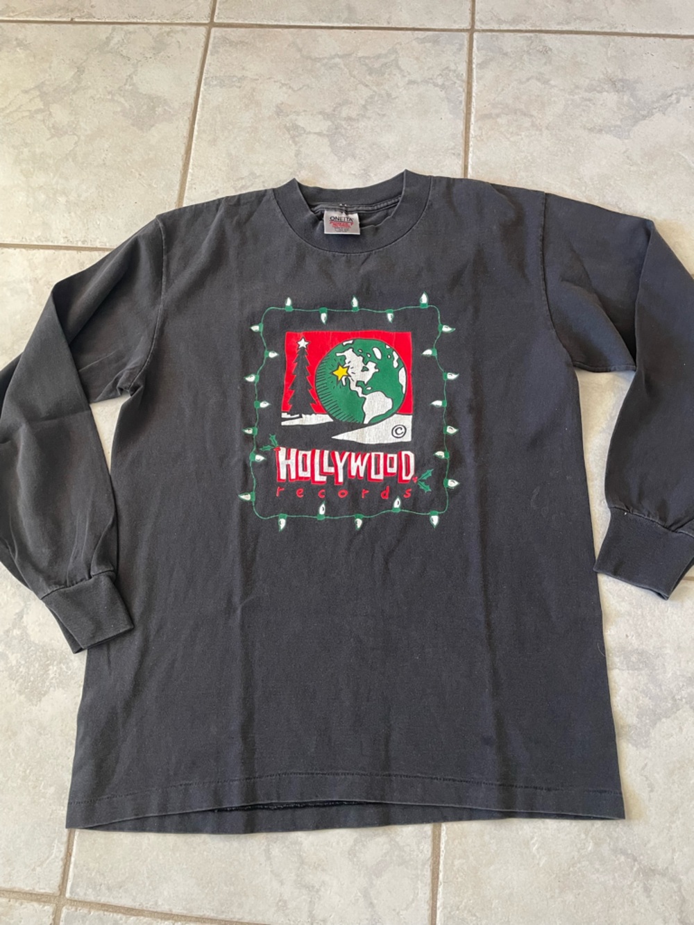 1990 Hollywood Records” 100% cotton tee shirt. List  of entertainers on back.